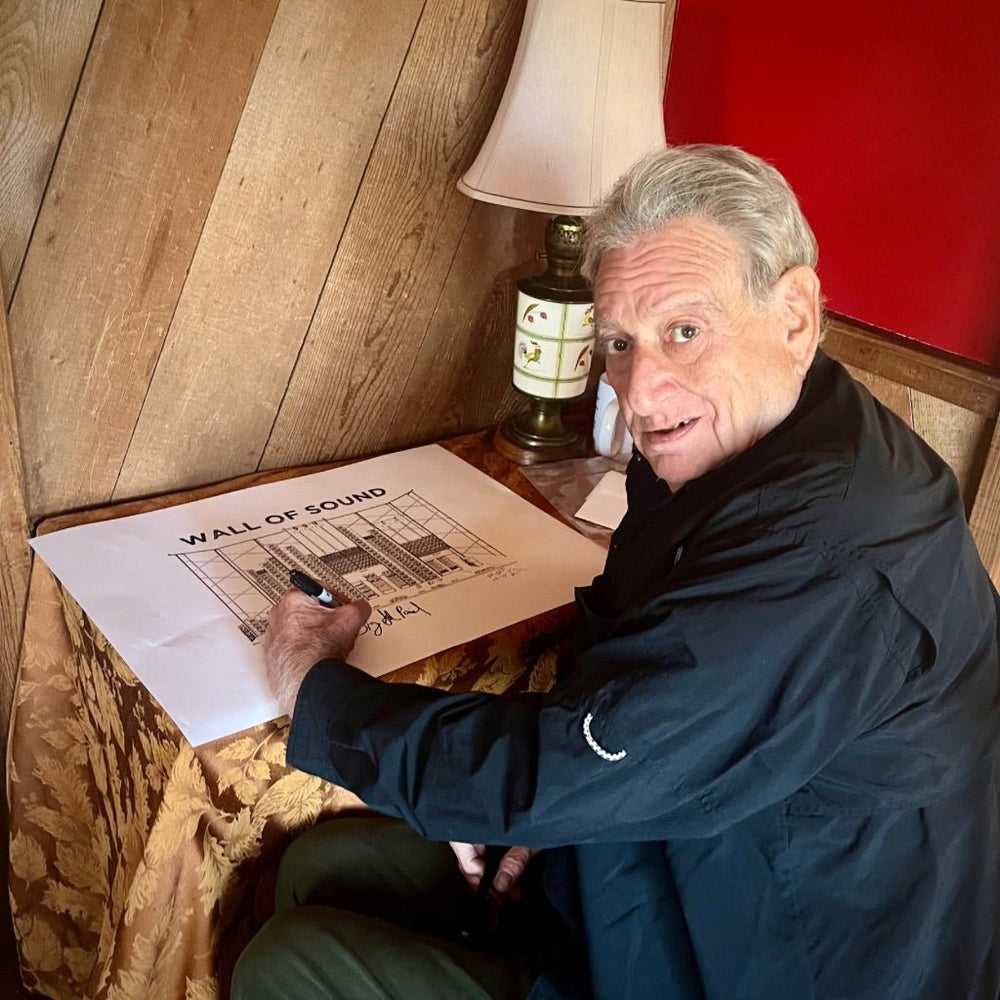 Picture of Big Steve Parish hand signing the Wall of Sound Poster - Retroactv Merch Inc.